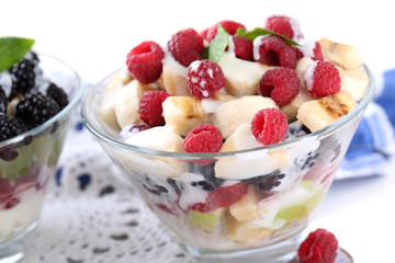 Fruit salad in glass bowls, isolated on white