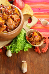 Chili Corn Carne - traditional mexican food, in wooden bowl,