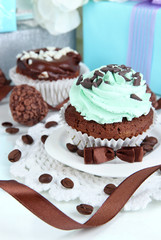 Tasty cupcake with gifts close up