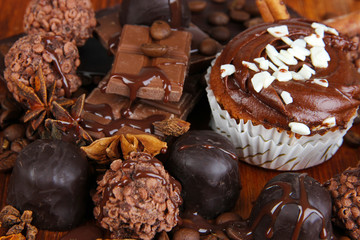 Tasty cupcake with different sweets close up