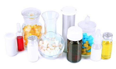Medical bottles and pills isolated on white
