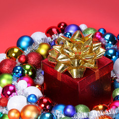 Christmas Gift with Gold Bow and Colorful Balls
