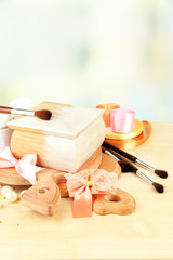 Handmade wooden box and art materials for decor, on table