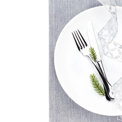 Bright Christmas table setting place with festive decorations on