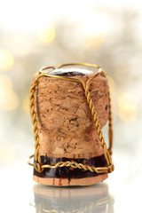 Champagne cork on Christmas lights background
