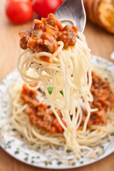spaghetti bolognese on a fork