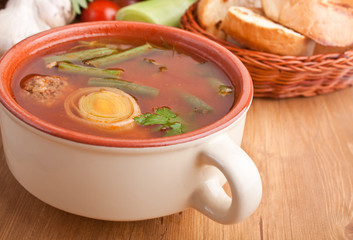 vegetable soup with meatballs, green beans and bread