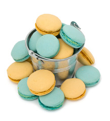 blue and yellow macarons over white