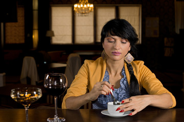 Woman sitting at a bar having coffee