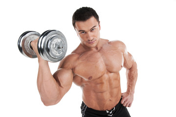 Fototapeta na wymiar Portrait of sexy muscular man training with dumbbell.