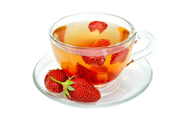 Tea with strawberries in a glass cup