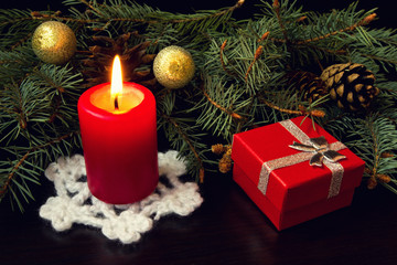 Fototapeta na wymiar red candle and christmas gift box
