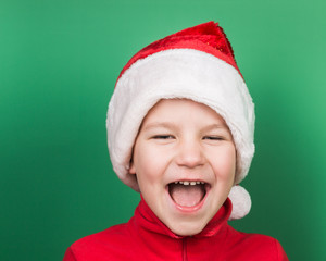 Santa boy playing on green background