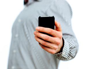Closeup image of a male hand holding smartphone 
