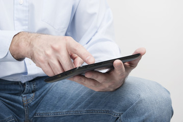 Close up of human hands holding digital tablet