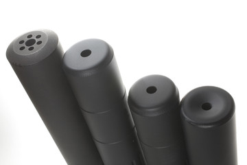 Four silencers of different lengths and styles isolated on a white background