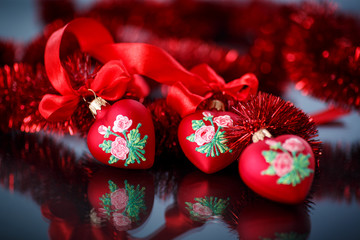 Christmas red hearts with red garland