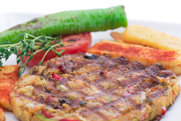 Vegetarian food on plate with french fries close-up