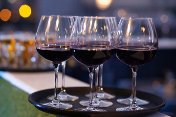 red wine glasses on tray