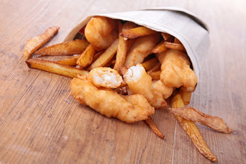 fish and chips in paper bag