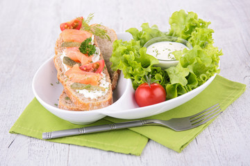bread toast with salmon and salad