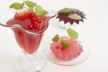 Red currant jelly with lemon balm leaves.
