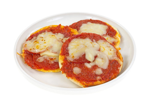 Bite sized pizzas on a small plate