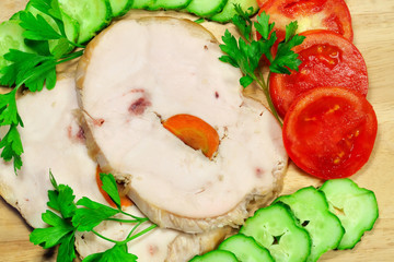 Two pieces of chicken ham with vegetables