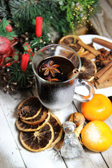 Traditional Christmas punch on the wooden background
