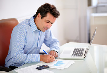 Attractive boss working on his documents