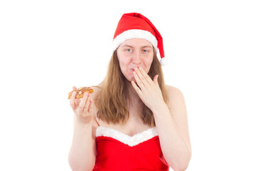Young Mrs. Claus taken by surprise eating gingerbread