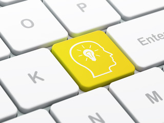 Data concept: Head With Lightbulb on keyboard background