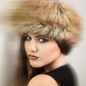 Gorgeous brunette wearing brown fur hat