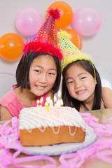 Obraz na płótnie Canvas Cute little girls at birthday party