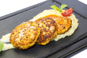 cutlets fried in carrot sauce with mashed potatoes