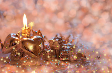 Christmas background with candle, hearts and gifts