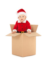 Cute baby-santa with beautiful blue eyes inside the box