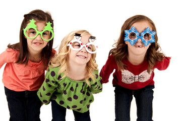 silly girls wearing fun christmas glasses