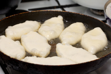 patties are fried in a pan