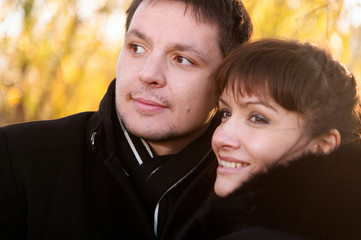 Fototapeta premium Couple on the yellow leaves as background