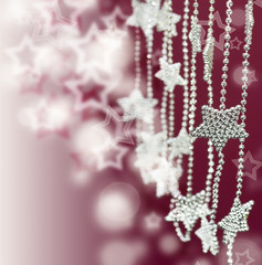 Silver Stars garland on pink blur background