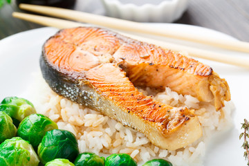 Fried salmon with rice and brussels sprouts