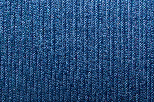 Blue knitted fabric texture abstract background