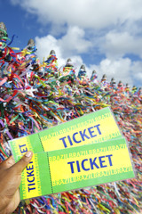 Hand Holds Tickets Colorful Brazilian Background