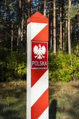 Border post with the emblem of the Polish.