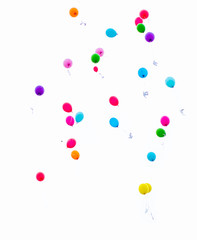 colorful balloons released into the sky on a white background