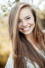 Face of a beautiful young smiling girl - close up