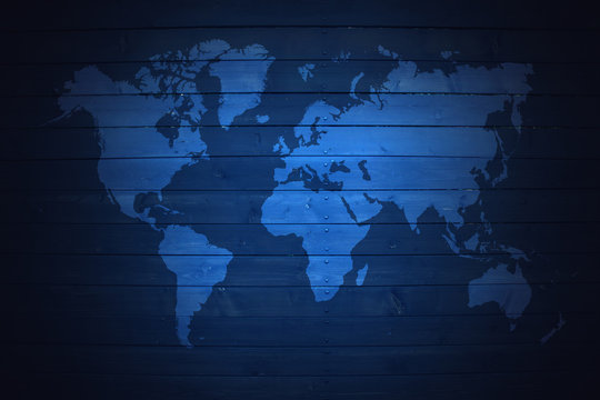 world map on blue wooden fence background