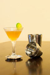 Cosmopolitan cocktail with Cocktail shaker and lime
