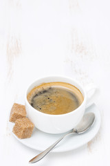 cup of coffee with sugar on wooden table and space for text